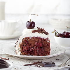 Black forest cake ,decorated with whipped cream and cherries Schwarzwald pie, dark chocolate and cherry dessert
