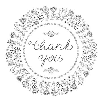 Hand lettered  thank you message with decorative floral frame. Doodle. Vector.