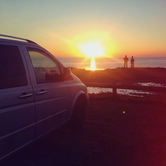 Fototapeta na wymiar Two people on a riad trip enjoying sunset