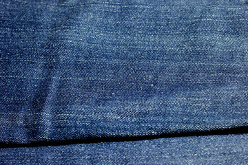 Naklejka premium Texture of blue jeans background.