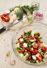 Fresh vegetable salad with broccoli, cauliflower, marinated cucu