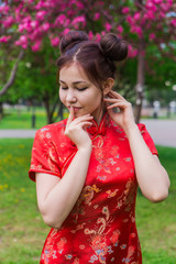 Beautiful asian girl in traditional chinese red dress.