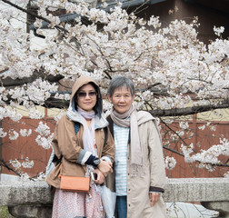 Obraz na płótnie Canvas Senior mother and daughter looking to the camera at Nishikyo-ku, Kyoto, Japan