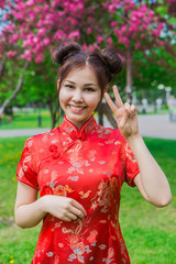 Beautiful asian girl in traditional chinese red dress.