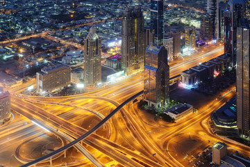 Naklejka na ściany i meble Aerial night view of skyscrapers of Dubai World Trade center