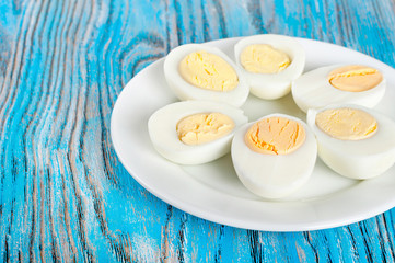 Boiled hen eggs in a white plate