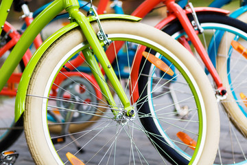 Fototapeta premium Three beautiful lady city bikes