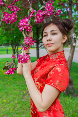 Beautiful asian girl in traditional chinese red dress.