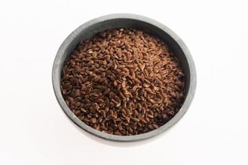 Linseeds on white background