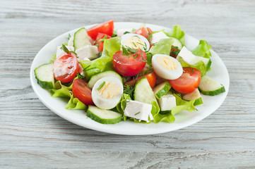 Fresh salad with quail eggs