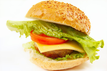 Big tasty burger with cheese and chop on a white background