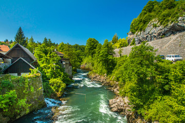 Fototapeta na wymiar Canyon of Korana river and beautiful village of Rastoke near Slunj in Croatia, old water mills on waterfalls