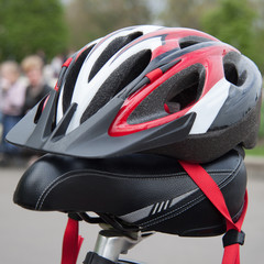 Cycling helmet on a bicycle seat