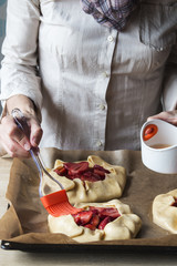 Woman preparing pastry for cooking sweet bakery, strawberry gale