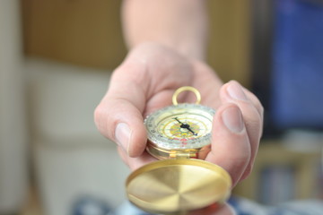     Businessman with a compass holding in hand, color tone film look 

