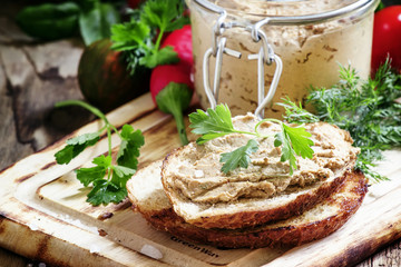 Sandwiches with liver pate on the cutting board, selective focus