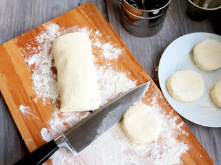 Cottage cheese pancakes being made on a wooden board