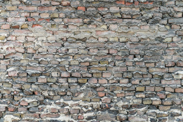 old dirty and grainy brick stone city underground wall with all kind of different color textures urban style background