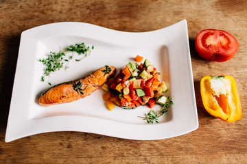 baked salmon on a white plate