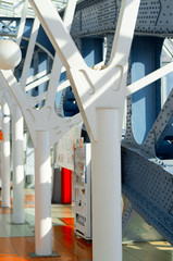 Metal poles pedestrian covered bridge with lots of rivets. Vintage tinted.