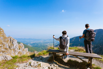 Young couple on top of a mountain