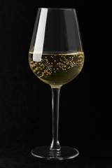 White sparkling wine glass on black background, clipping path