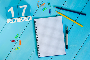 September 17th. Image of september 17 wooden color calendar on white background. Autumn day. Empty space for text