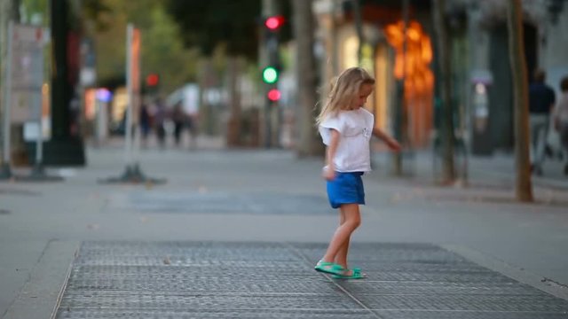 Adorable little girl at european city outdoors