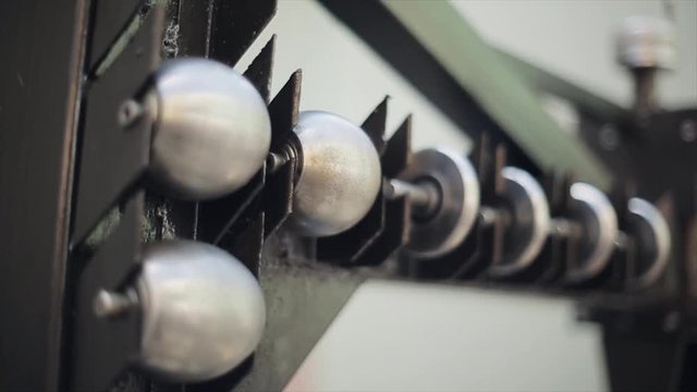 View of metal clean balls in iron hols of incisors. Construction. Design. Details. Close up