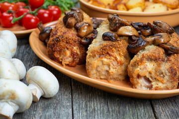 roulade of pork with roasted mushrooms and potatoes