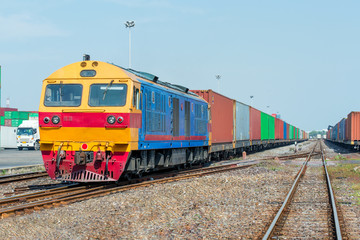 Naklejka premium Cargo train platform with freight train container at depot