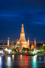 Fototapeta premium Night view of Wat Arun temple and Chao Phraya River, Bangkok, Th