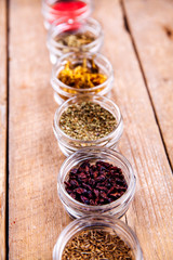 Obraz na płótnie Canvas Spices in jars on wooden background. Food