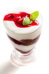 Raspberry jelly with cream on white background
