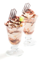 Ice cream tiramisu with cocoa on a white background