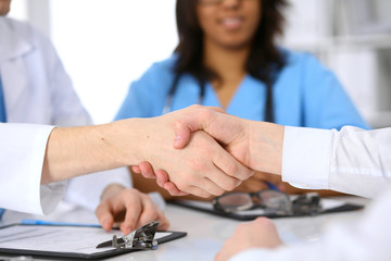 Doctor and patient handshake
