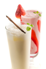 Strawberry and vanilla smoothies on white background