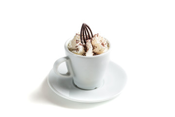 Coffee with chocolate and whipped cream on a white background