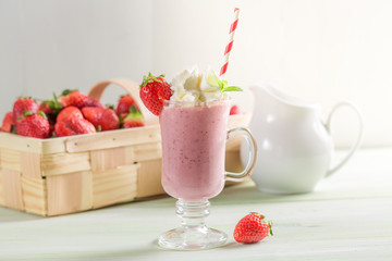 Strawberry smoothie made of fresh fruits and milk