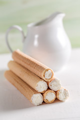 Waffle tube filled with fresh cream and milk