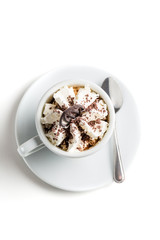 Coffee with whipped cream and chocolate on a white background