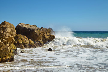 Waves beating against coastal rocks on the cliffs