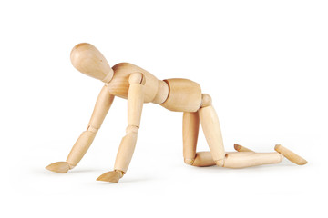 Man crawls on his knees isolated over white background. Abstract image with a wooden puppet