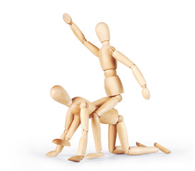 Man is riding on another one. Abstract image with a wooden puppet