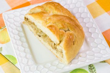 Piece of fresh baked cabbage mushrooms pie.