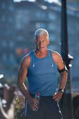 portrait of handsome senior jogging man