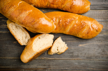 Fresh bread on wooden background