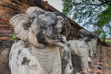 Fototapeta na wymiar Details of pagoda base at Wat Maheyong, Ancient temple and monument in Ayutthaya province, Thailand