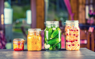 Preserving. Pickles jars. Jars with pickles, pumpkin dip, white cabbage, roasted red yellow pepper....