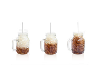 Cola in glass  jar on white background